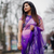 a woman flaunting her violet saree