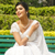 a woman wearing white chikankari saree